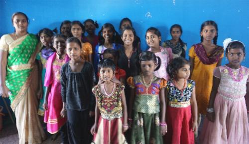 A Picture of Orphan girls with their overseer Pastor Samuel in India